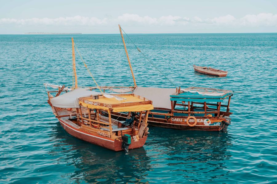 Traditional boats on turquoise water near Zanzibar